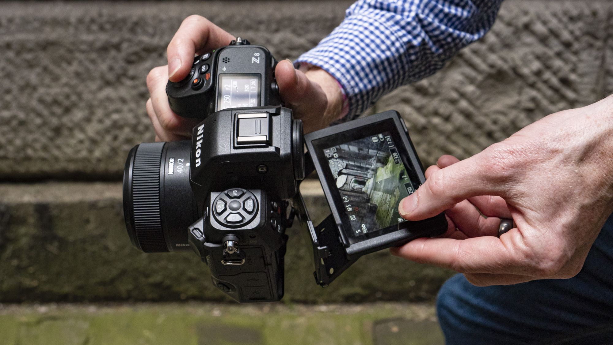 Nikon Z8 camera in the hand with screen pulled out
