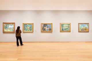 A woman looking at art in The Courtauld