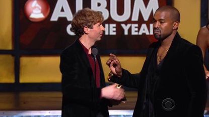 Beck and Kanye West onstage at the 2015 Grammy Awards.