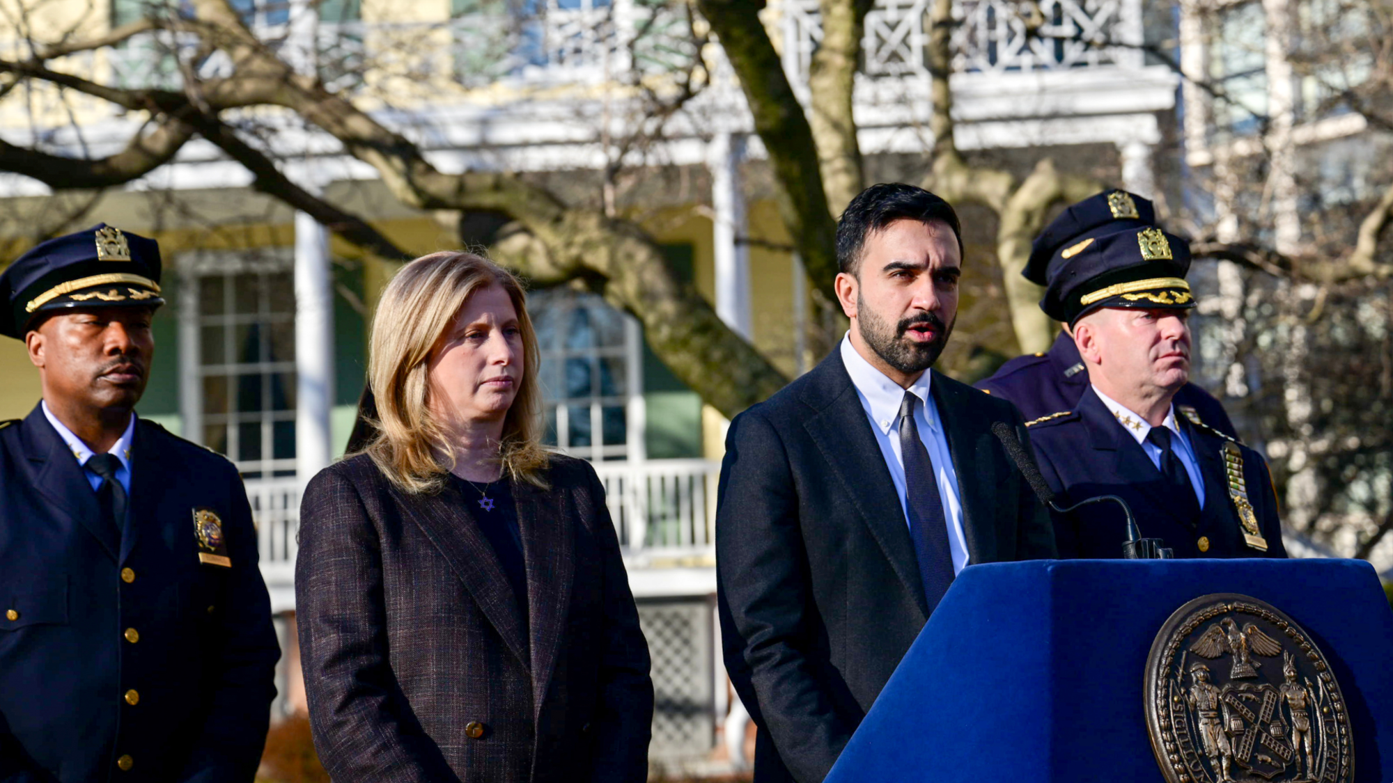 Jessica Tisch, commissioner of the New York Police Department (NYPD), second left, and Zohran Mamdani, mayor of New York, center, during a news conference at Gracie Mansion in New York, US, on Monday, March 9, 2026. New York City's police commissioner said authorities are investigating whether an incident in which two men allegedly brought improvised explosive devices to a protest outside the mayor's residence in New York was an act of "ISIS-inspired" terrorism. Photographer: Lloyd Mitchell/Bloomberg via Getty Images