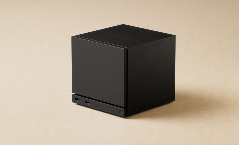 Valve Steam Machine render showing the cube-shaped desktop PC on a cream-colored background