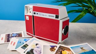 A red and gray Lomography Lomo'Instant Square Glass instant camera