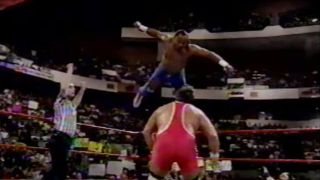 2 Cold Scorpio jumping off the turnbuckle onto Dr. Death Steve Williams