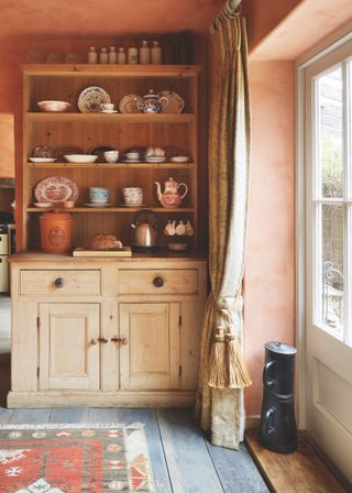 rustic kitchen with curtain at French doors