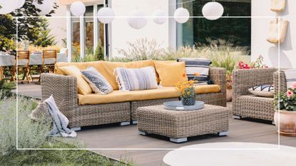 picture of rattan outdoor sofa set with yellow cushions in garden