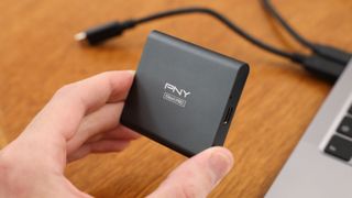 PNY EliteX-Pro SSD on a wooden table