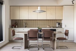 kitchen with vintage chairs at Vabel Lawrence Penthouse