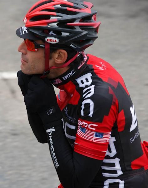 George Hincapie (BMC) makes an on-the-road helmet adjustment.