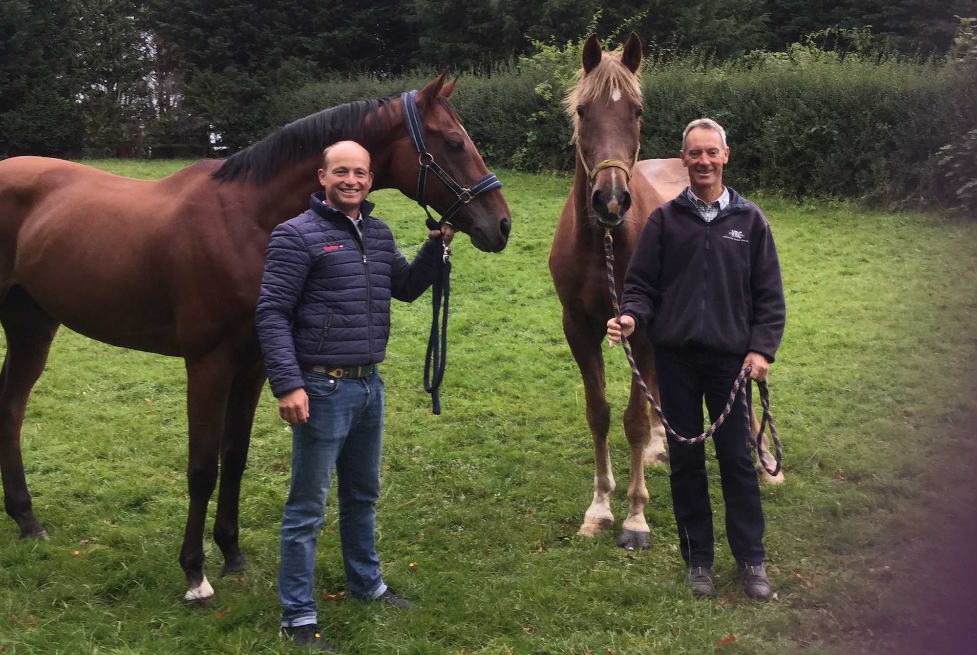 Image shows Michael Jung and La Biosthetique-Sam, who would go on to win Badminton in 2016, alongside 1998 Badminton winners Christopher Bartle and Word Perfect, in a paddock together.