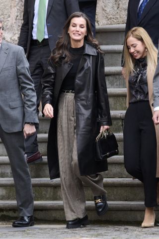 Queen Letizia's black leather trench coat