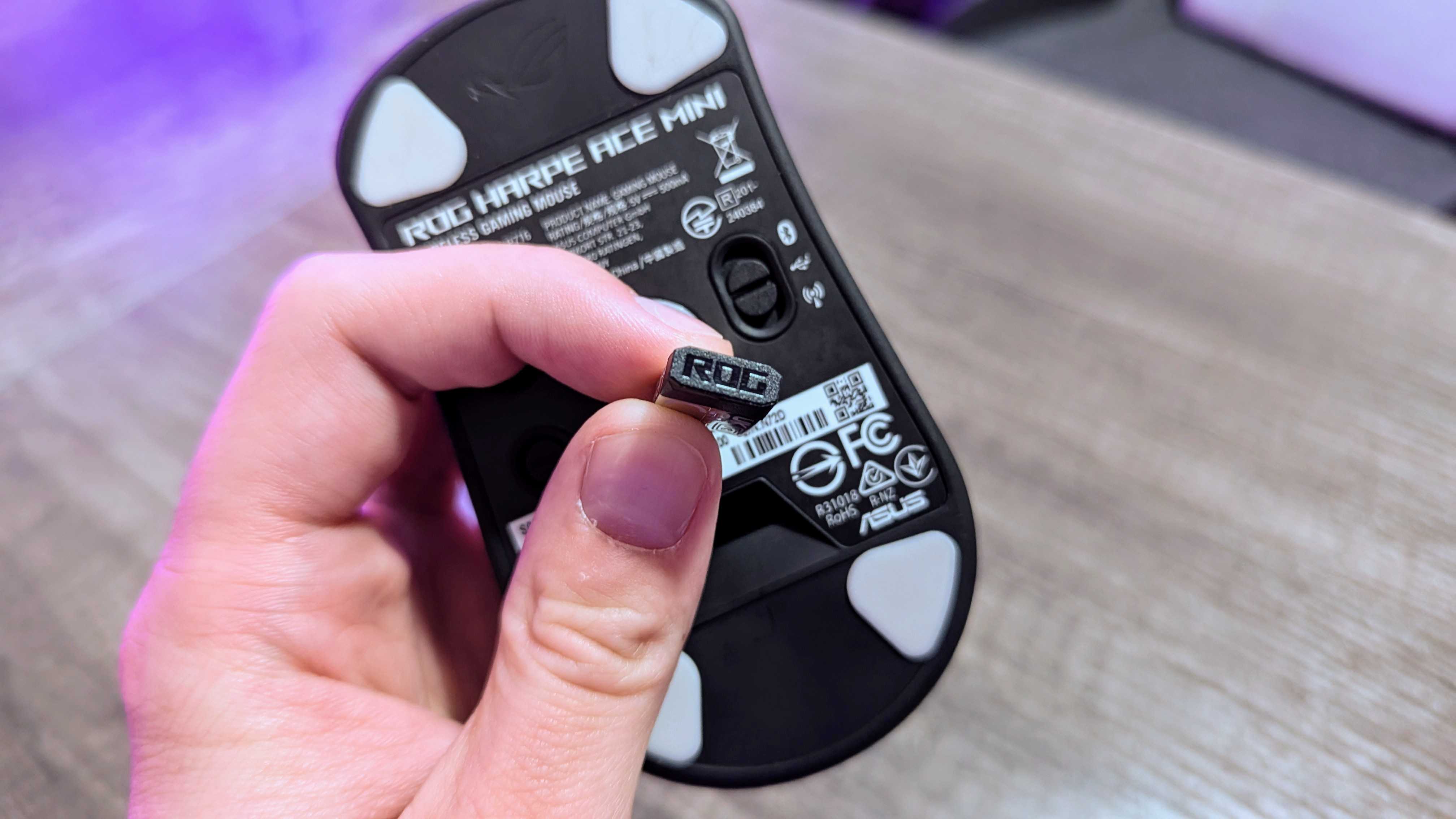 Image of the ASUS ROG Harpe Ace Mini wireless gaming mouse.