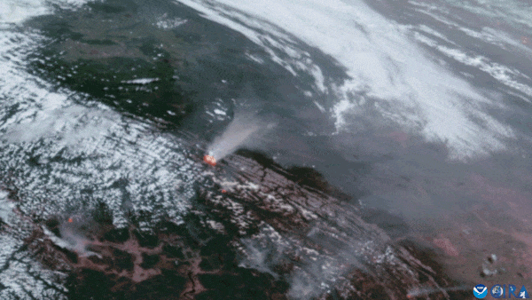 A high resolution view shows wildfires raging across the Pacific Northwest