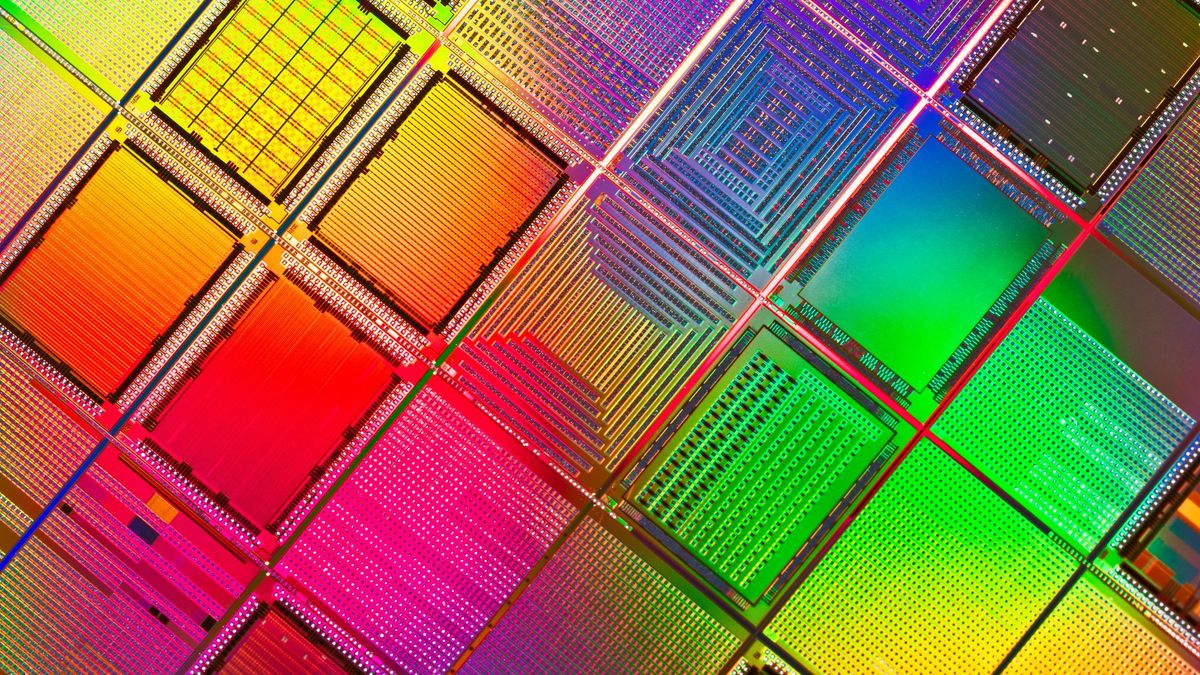 A close up of a multi coloured computer wafer