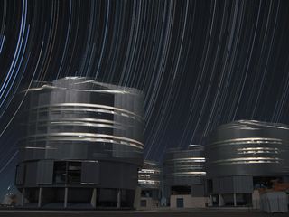 Stars appear to whirl above Cerro Paranal in the Atacama Desert in Chile.