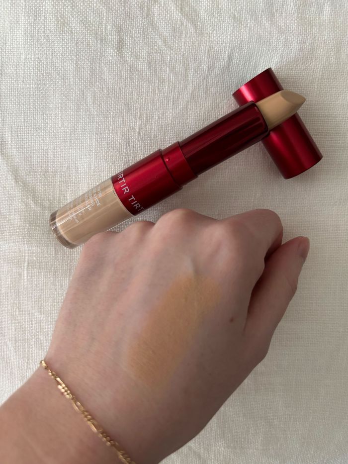 Deputy beauty editor Grace Lindsay testing a TirTir concealer on the back of her hand