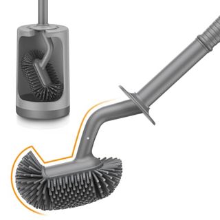 A grey silicone toilet brush with a grey plastic stand