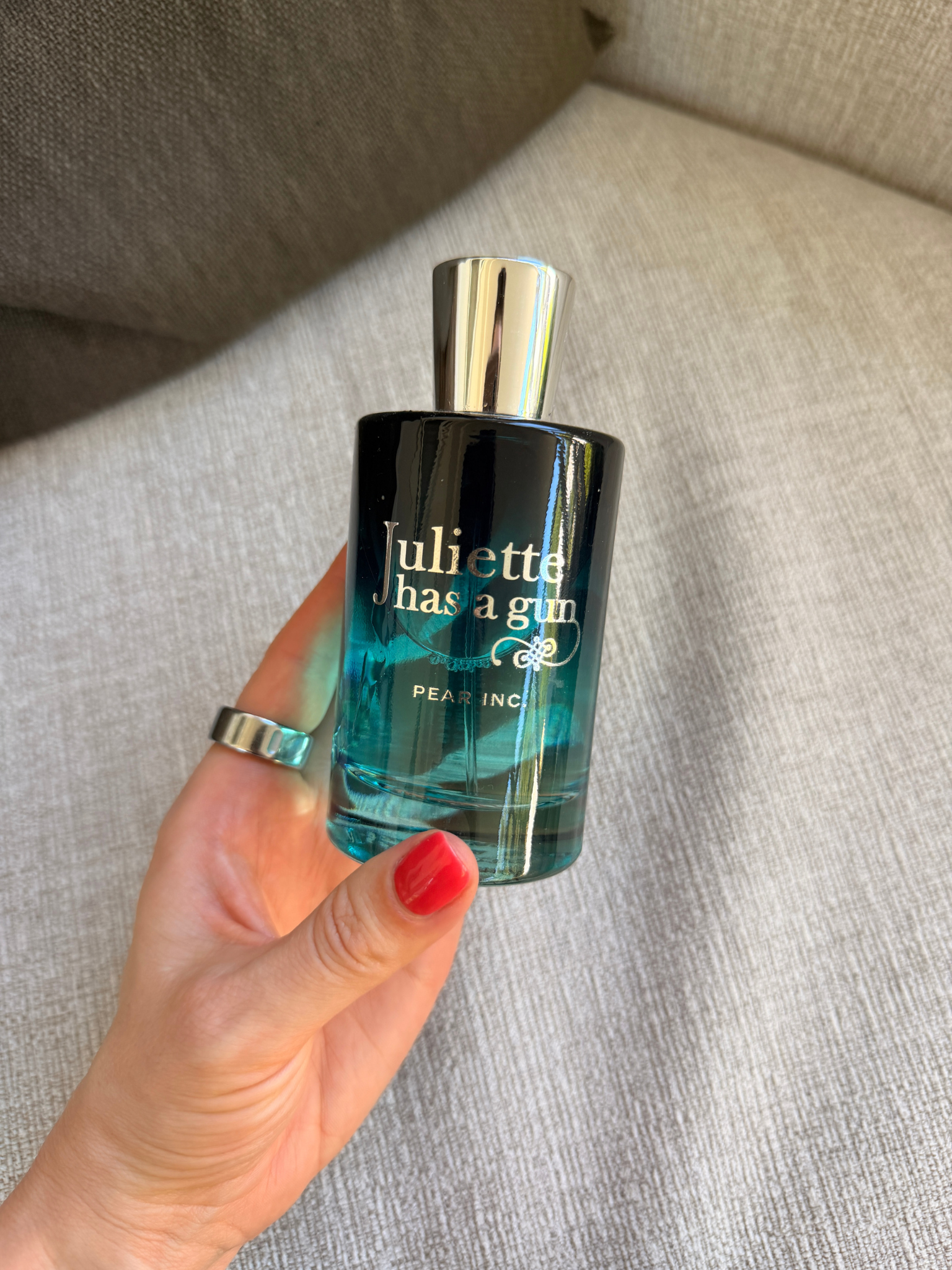 Grace Day holding the Juliette Has A Gun perfume
