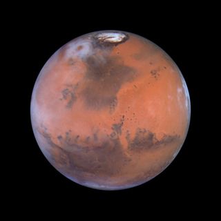 The north polar sand sea and the Acidalia Planitia (the large, dark region in the center) of Mars are primarily composed of glass.