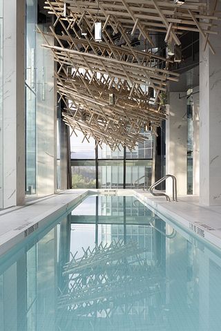 swimming pool with timber ceiling in Alberni by Kengo Kuma
