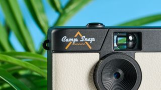 A white and black Camp Snap Screen-Free digital camera