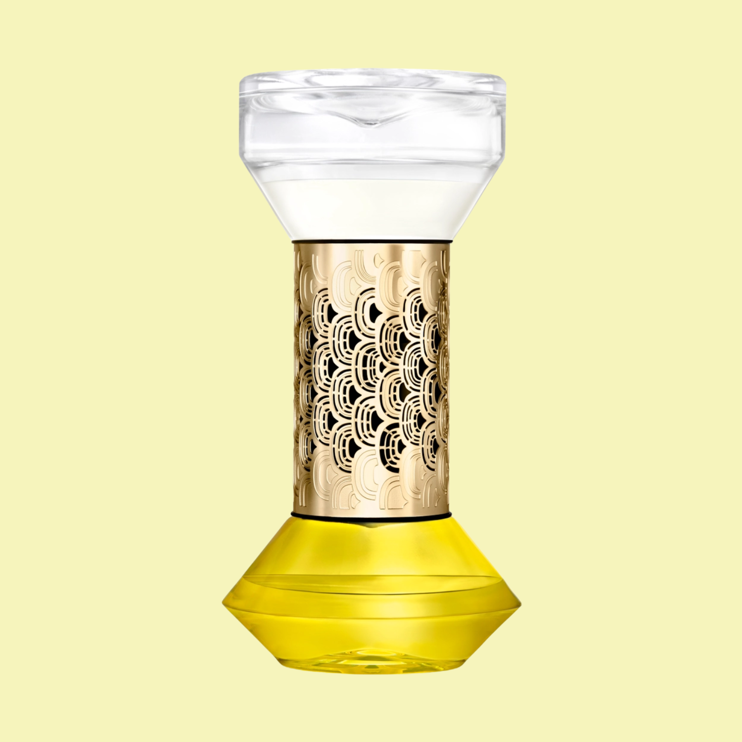 A glass diffuser against a butter yellow backdrop