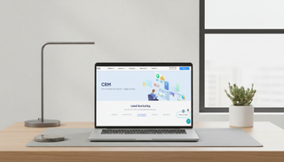 Chime CRM being used on a macbook in a modern office