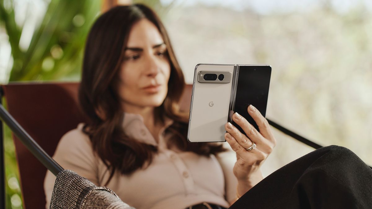 Google Pixel Fold with white back panel in the hand