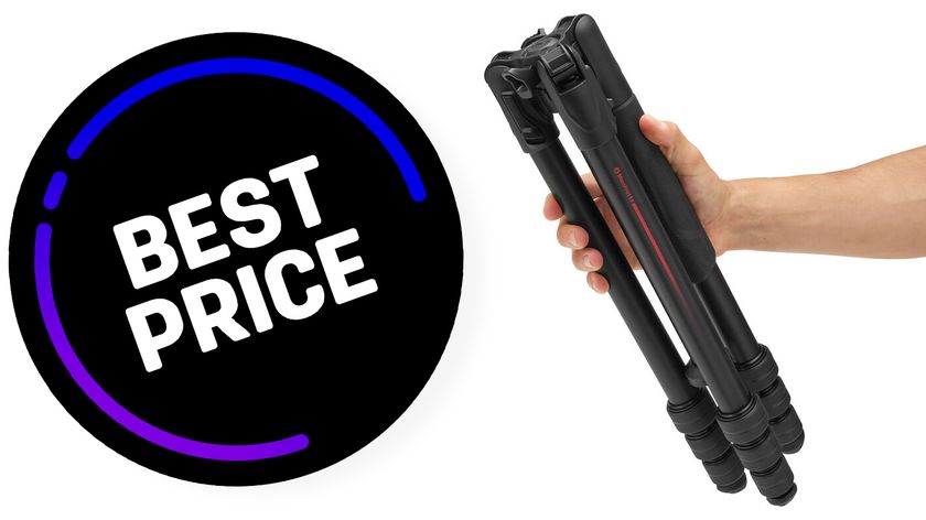 Manfrotto Befree GT PRO aluminum travel tripod in hand with Best Price sticker