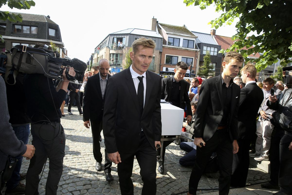 Jelle Vanendert, Andr&eacute; Greipel, Tiesj Benoot and Harm Van Houcke bring Lambrecht to the church