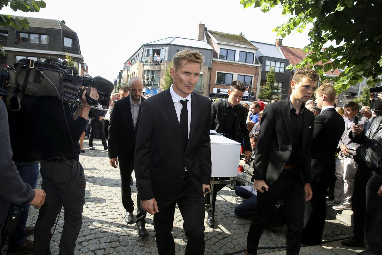 Jelle Vanendert, Andr&eacute; Greipel, Tiesj Benoot and Harm Van Houcke bring Lambrecht to the church
