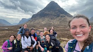 A group of women take a selfie after completing a mountain run