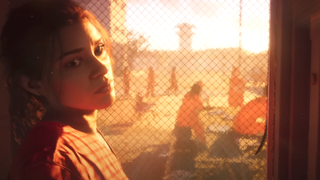 Lucia, a protagonist from Grand Theft Auto 6, looks over her shoulder at the camera while backlit by a prison yard.