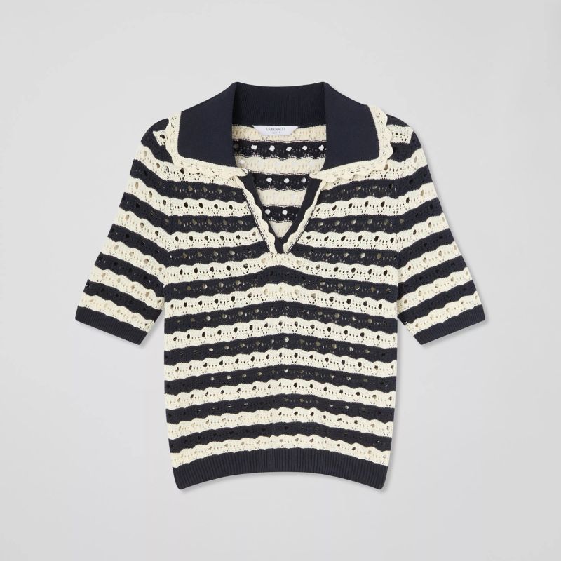 A cut out of a black and white knitted polo shirt from LK Bennett 