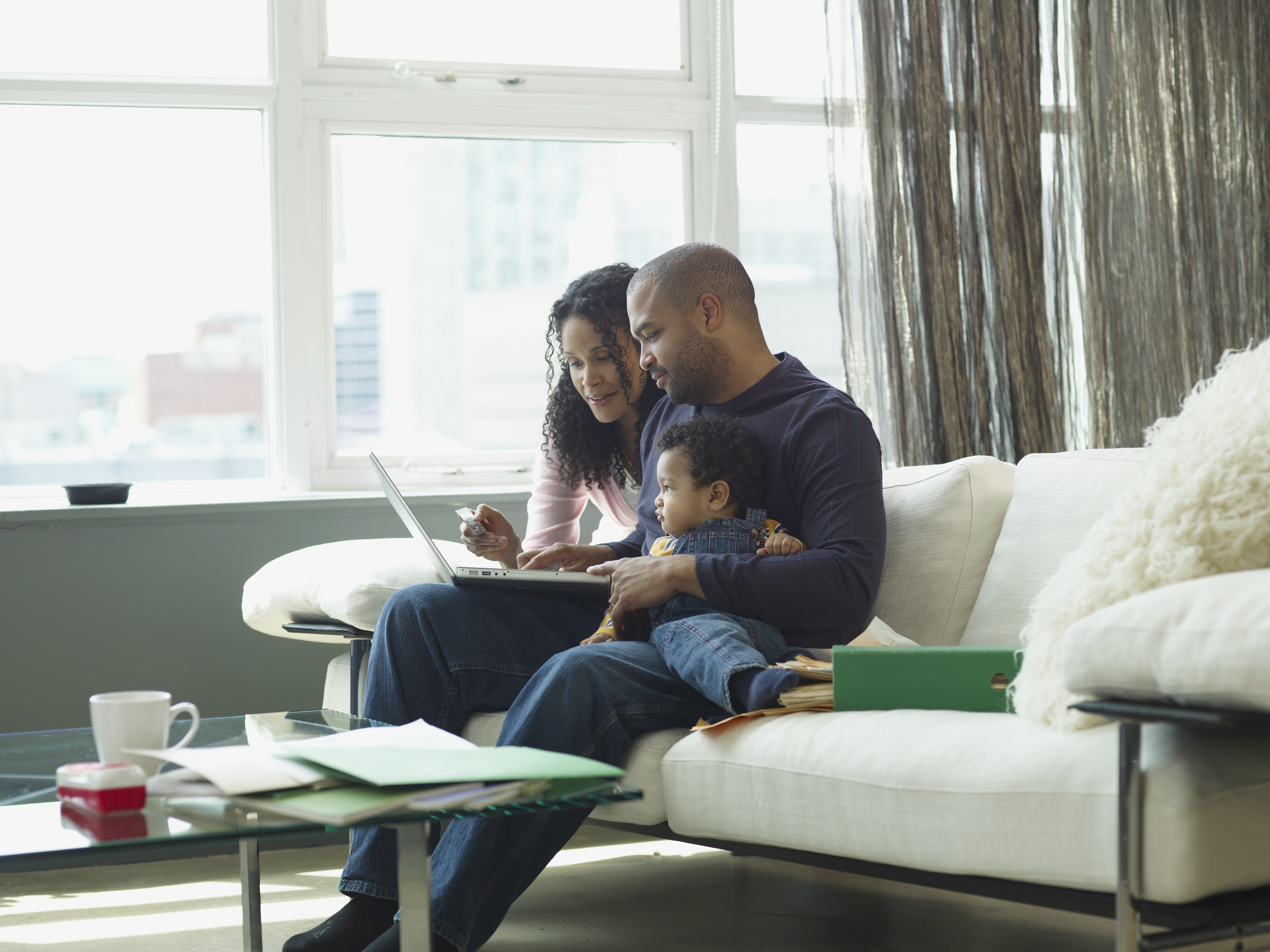 Family with underlying health conditions looking at laptop screen
