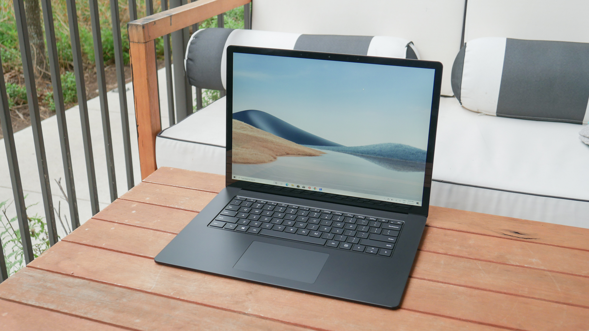 Microsoft Surface Laptop 4 (15-inch) on an outdoor wooden table