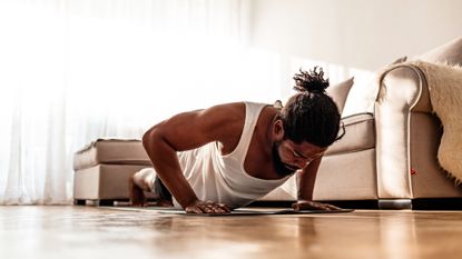 A man performing a push-up during a home workout