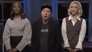 Elon Musk (Dana Carvey) hypes up Donald Trump in front of the SNL cast on Saturday Night Live