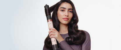 Model with Dyson Airwrap