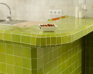 Green tiled kitchen countertop