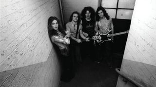 Van Halen pose backstage in a stairwell at the Lewisham Odeon prior to their performance, May 27, 1978.