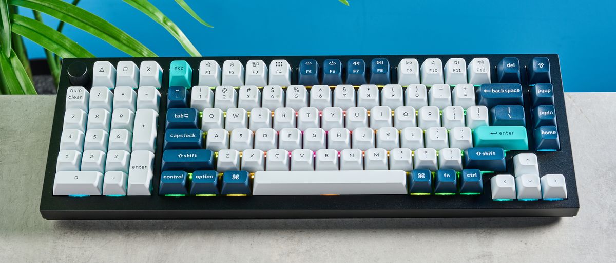 the keychron q12 max southpaw keyboard in navy blue with white and teal keycaps and red jupiter gateron switches