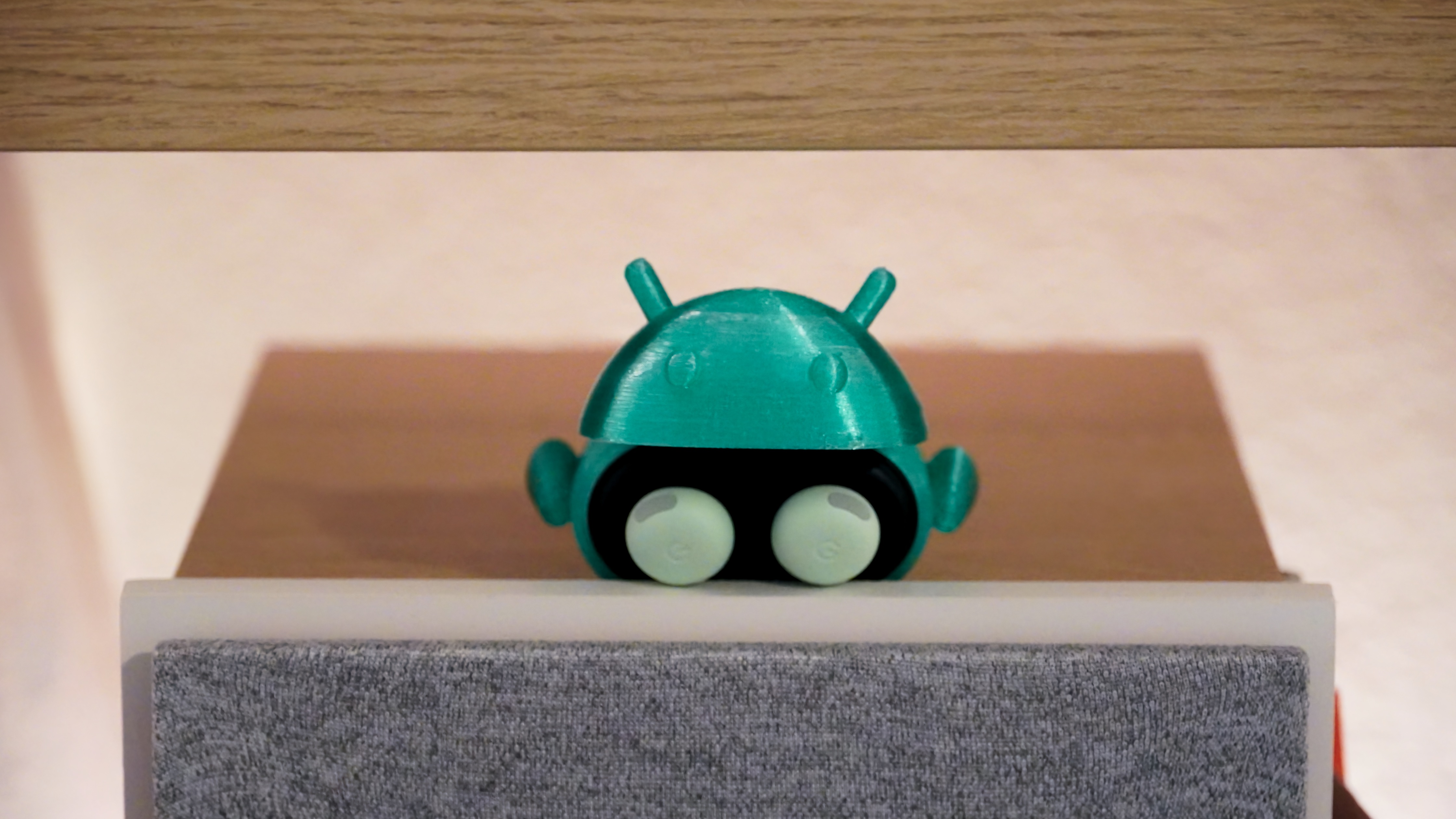The Android Bot 3D-printed case on a pair of Google Pixel Buds Pro 2.