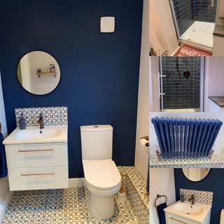bathroom with blue wall and round mirror and washbasin and toilet and tiles floor