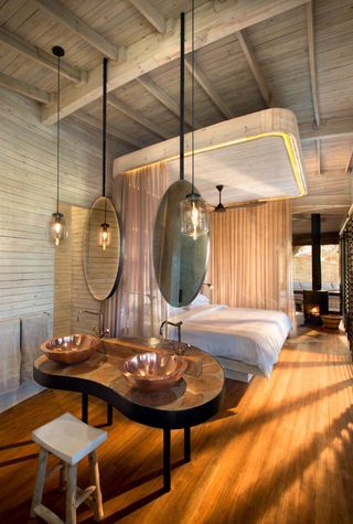 Sandibe Okavango Safari Lodge with wooden flooring, Maun Botswana