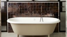 a bathtub painted beige with a brown zellige tile backsplash