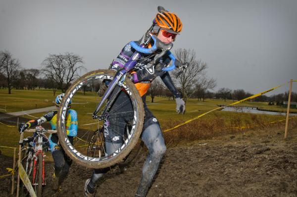 Barry Wicks (Kona) leads chase group up the muddy climb