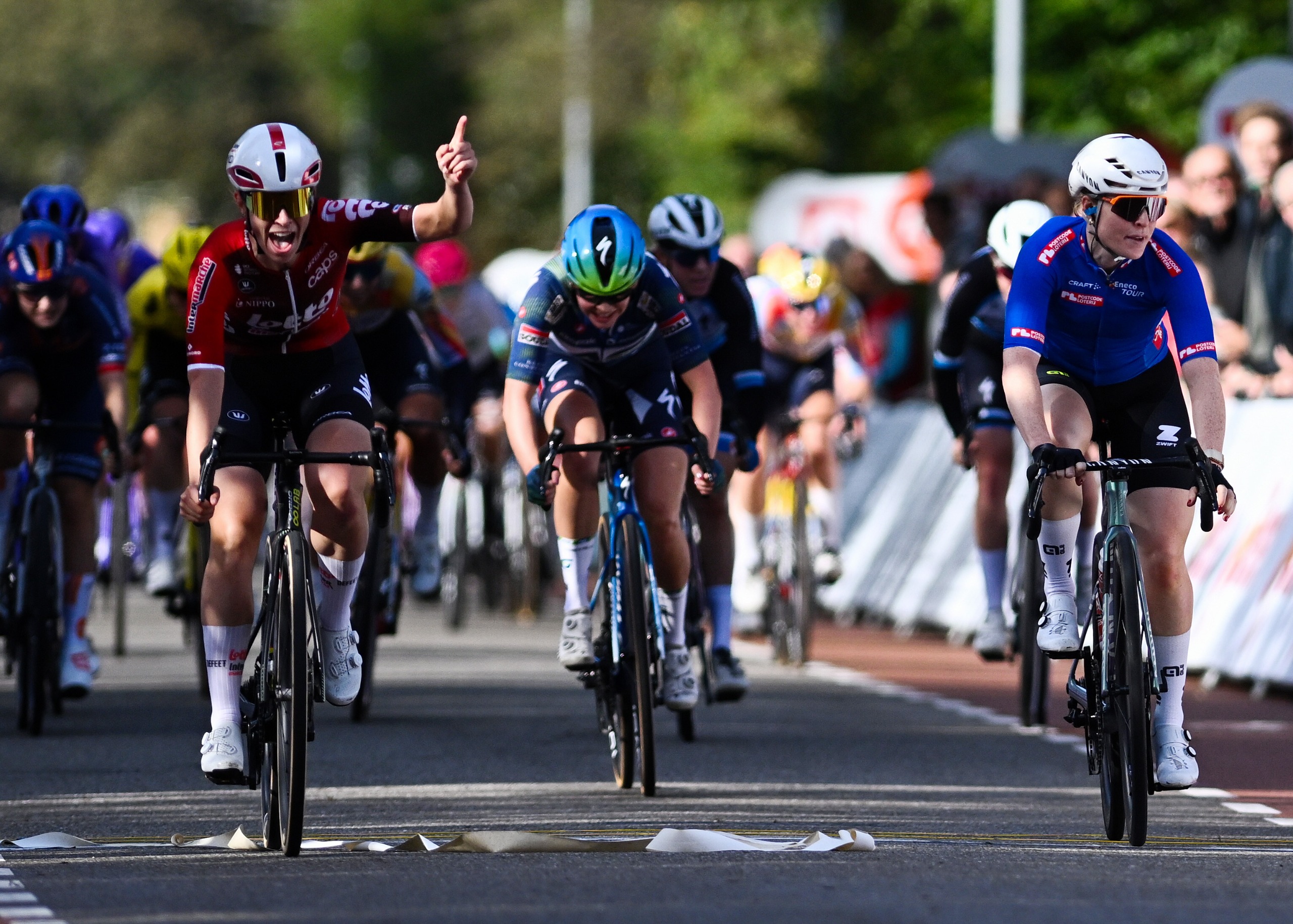 Sandrine Tas of Belgium and Team Lotto Intermarche Ladies celebrates at finish line as stage winner ahead of Charlotte Kool of Netherlands and Team Fenix-Premier Tech - Blue Points Jersey during the 28th Eneco Tour Women, Stage 1 a 79.5km a stage from Ede to Ede October 14, 2026 in Ede, Netherlands. (Photo by Luc Claessen/Getty Images)