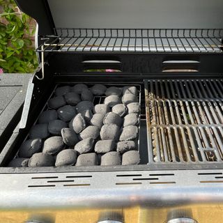 Grill with charcoal briquettes
