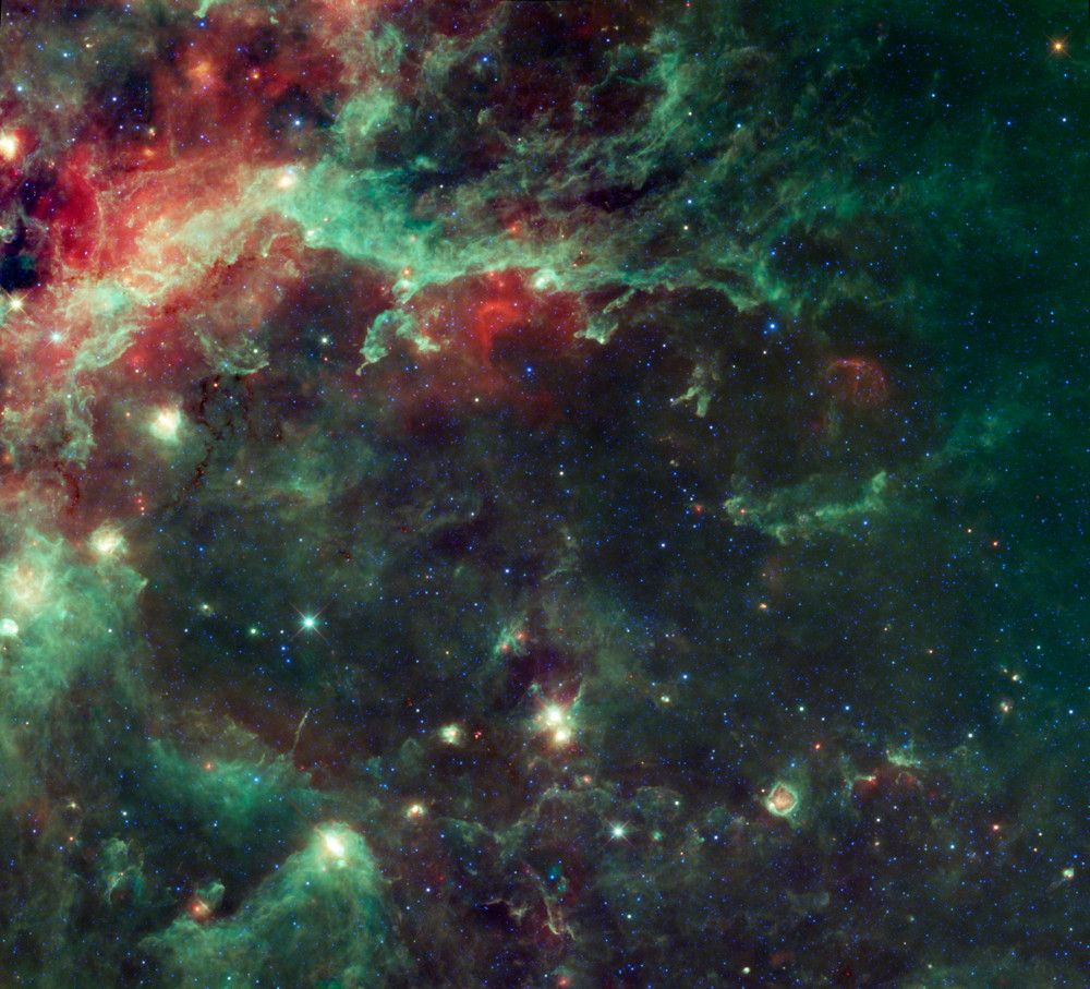 NASA’s Wide-field Infrared Survey Explorer, or WISE, shows a huge complex of star-forming clouds and stellar clusters found in the constellation Cygnus. Viewers can easily see the constellation Cygnus (the swan) in the northern hemisphere’s summer sky. The constellation also commonly goes by the name of the Northern Cross.