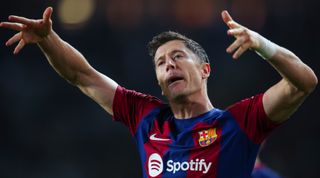 BARCELONA, SPAIN - NOVEMBER 12: Robert Lewandowski of FC Barcelona celebrates after scoring the team's second goal during the LaLiga EA Sports match between FC Barcelona and Deportivo Alaves at Estadi Olimpic Lluis Companys on November 12, 2023 in Barcelona, Spain. (Photo by Eric Alonso/Getty Images)